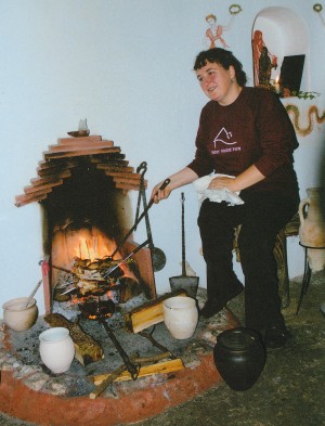  Sally Grainger taking part in a reconstruction at Butser Ancient Farm near Petersfield, Hampshire.